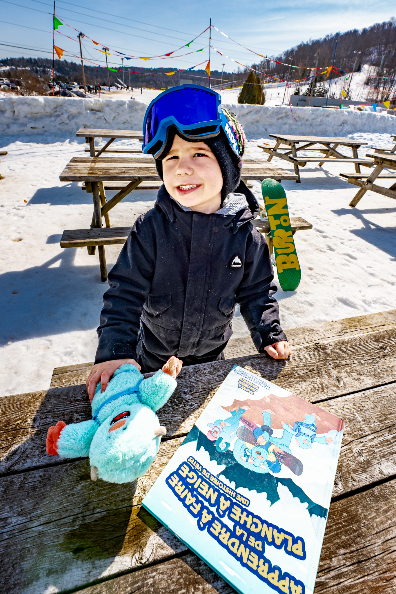 Child playing with Yeti Stuffy and Book
