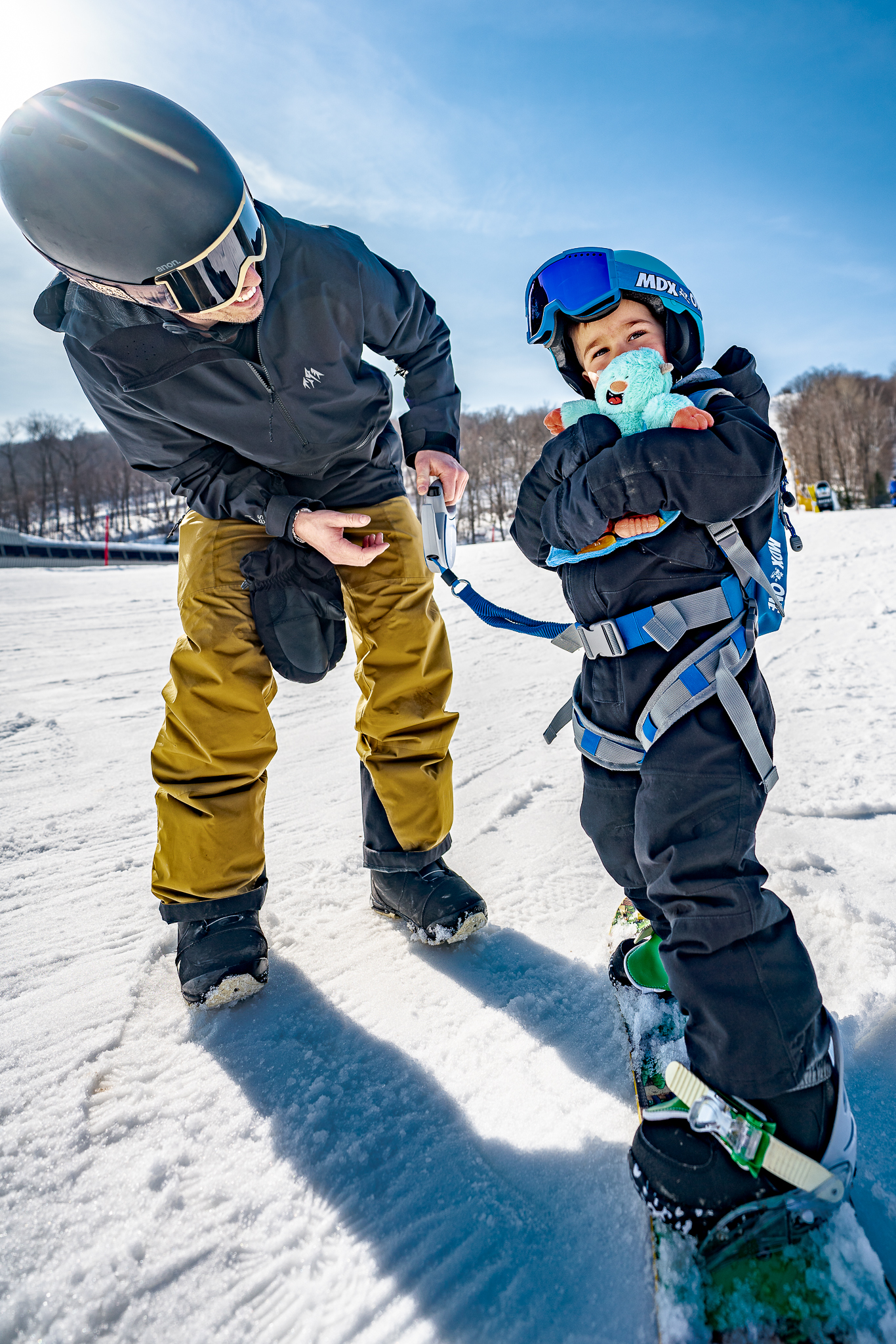Parent and child sharing a snowy mountain day with MDXONE gear